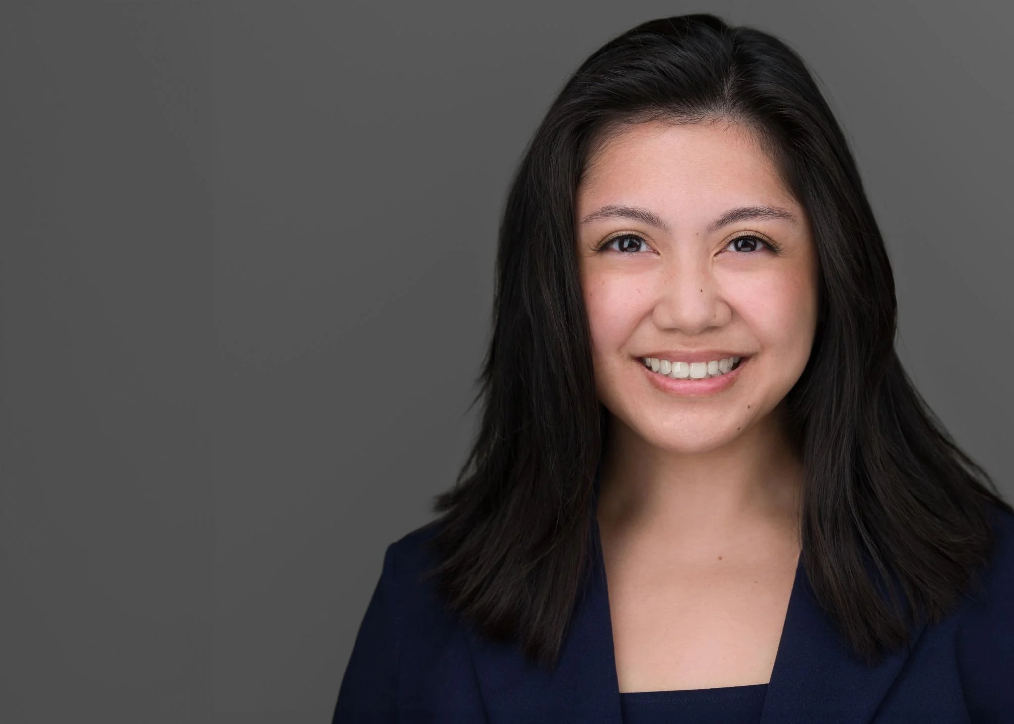 Young Latina Lady with long dark hair and a smile