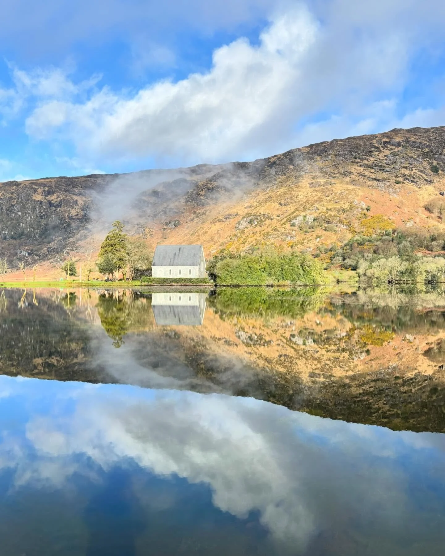 Finbar&rsquo;s Church, Gougane Barra, Co Cork. 6 Day Southwest Adventure Tour of Ireland. #gougane #gouganebarrahotel #gouganebarra #wings #smallgrouptravel #reflections #adventure #irelandtravel #ireland🍀 #lakesofinstagram #cloudsofinstagram #april