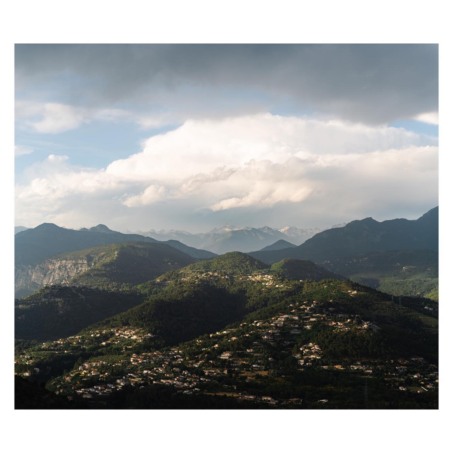 The many hillside villages and distant Alps across the valley from Carros.