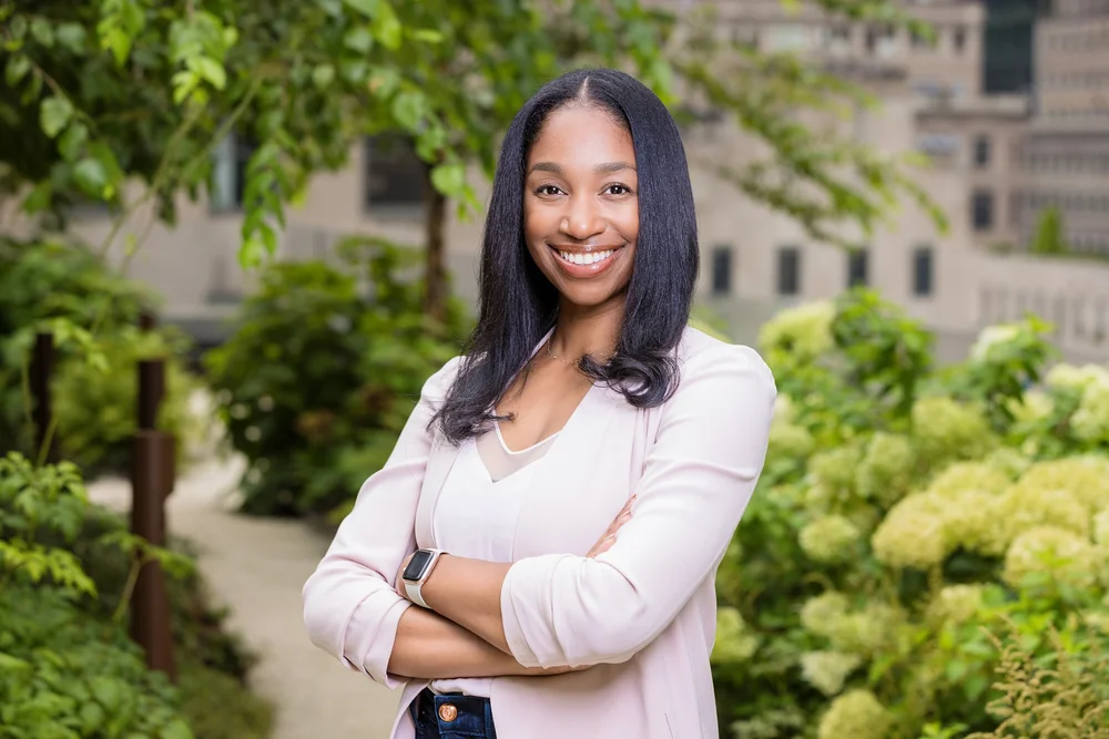 Outdoor personal branding portrait of a woman on a tree-lined New York street
