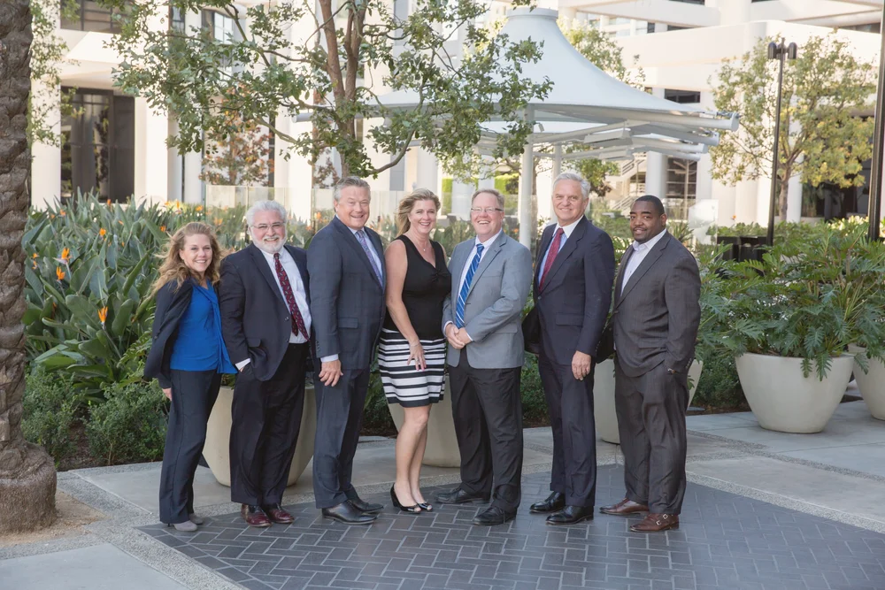 Group photo of professionally dressed guests at a shareholder event