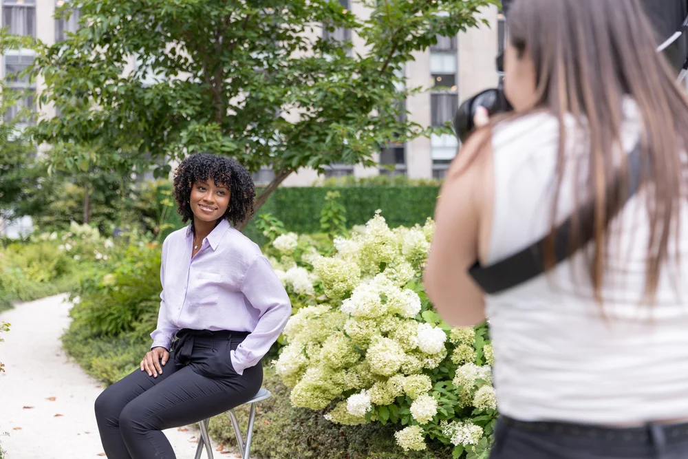Tenant photographed on a landscaped building terrace during a headshot amenity day