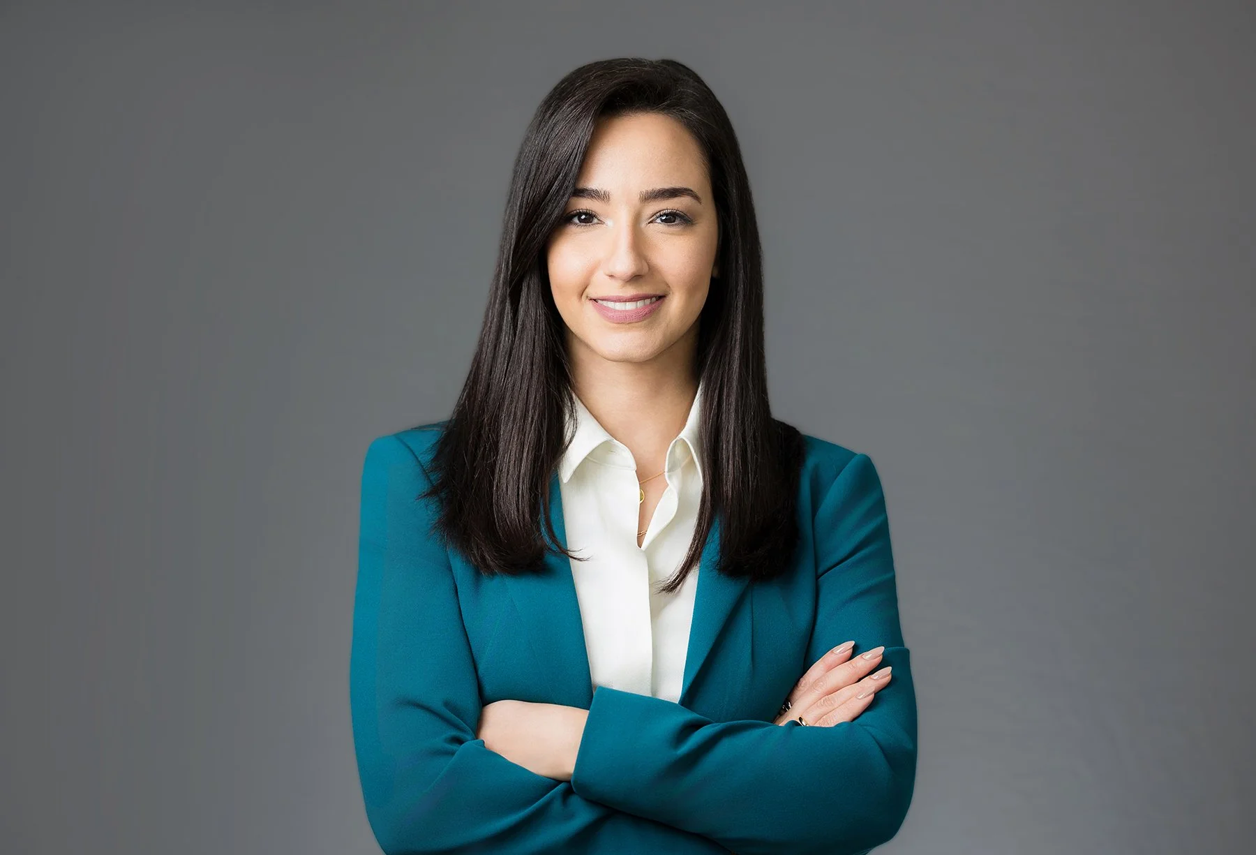 executive headshot on a grey background taken at a tradeshow
