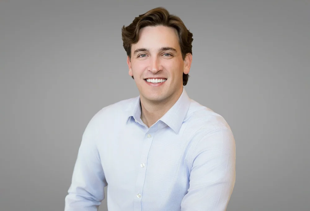 Branding and content portrait of a young New York professional in a light blue shirt, by Blue Sky's Studio