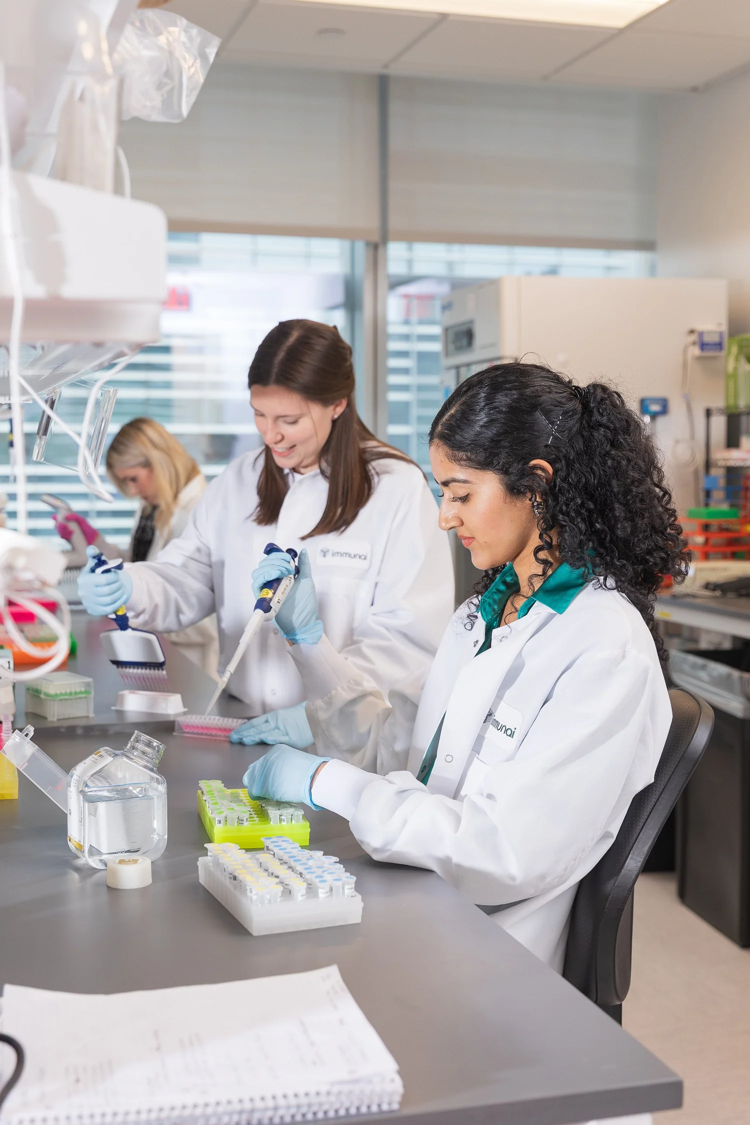 Scientists working in a laboratory with test tubes and lab equipment