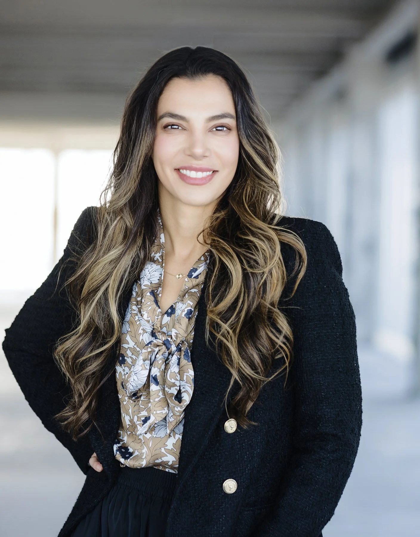 Executive headshot of a woman in a black blazer, NYC