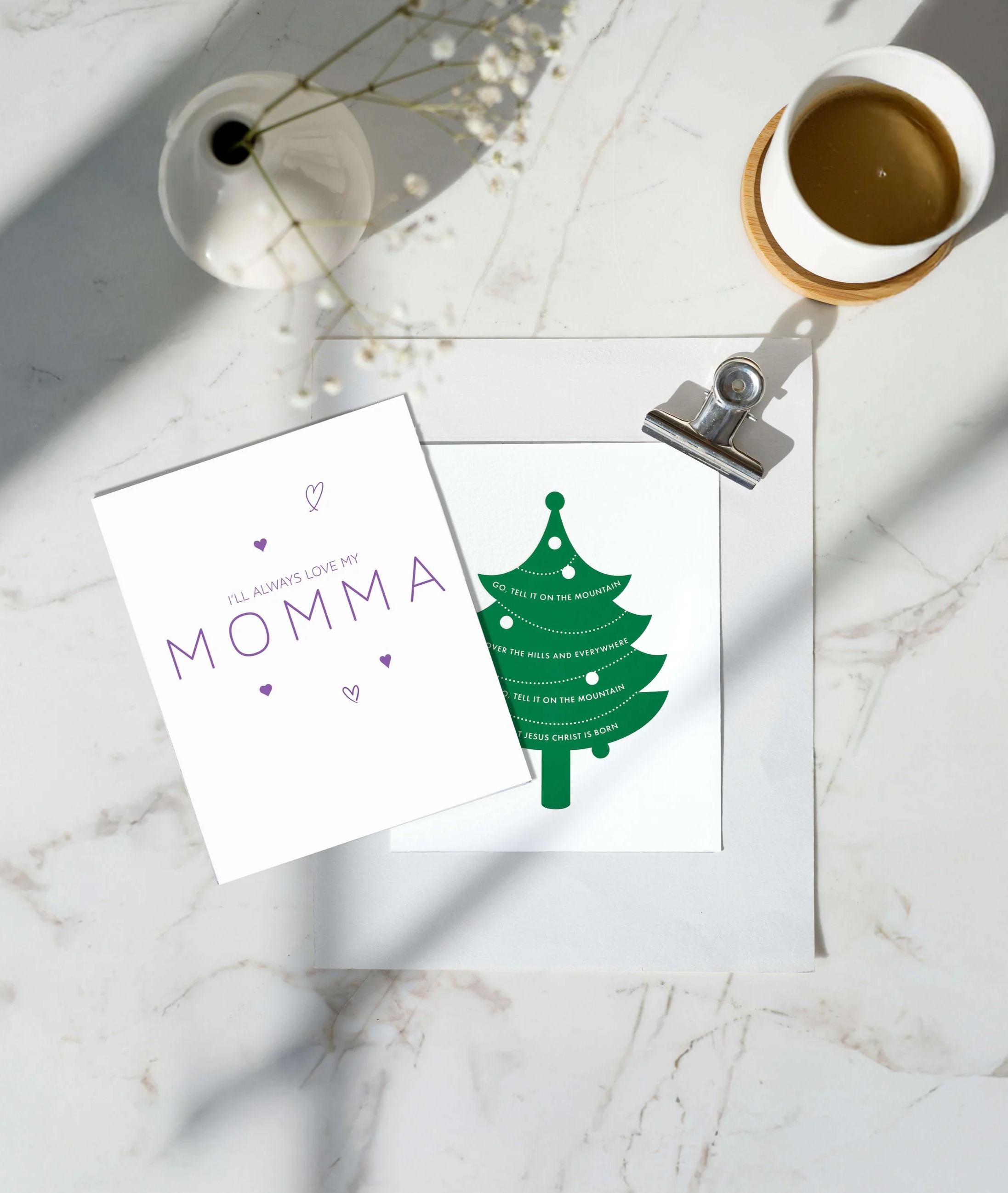 Mother's Day and Christmas cards on a marble table