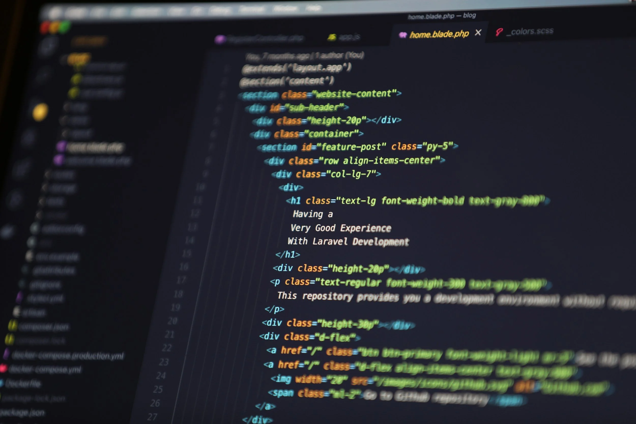 A computer screen displaying a dark-themed code editor with HTML code for a webpage, including sections, divs, headings, and links.