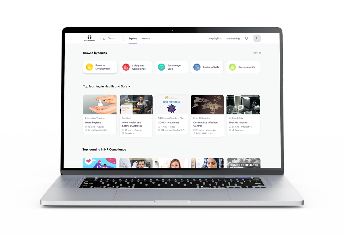 Laptop displaying an online learning platform with various health, safety, and HR compliance courses on the screen.