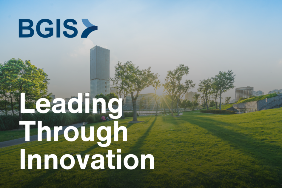 A park with green grass, trees, and city buildings in the background during sunset, featuring the BGIS logo and the text 'Leading Through Innovation'.