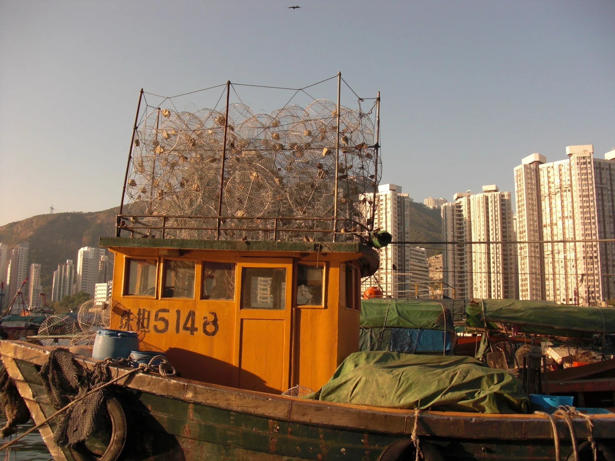 CIMG0389 · Fishing boat and tower blocks, Hong Kong