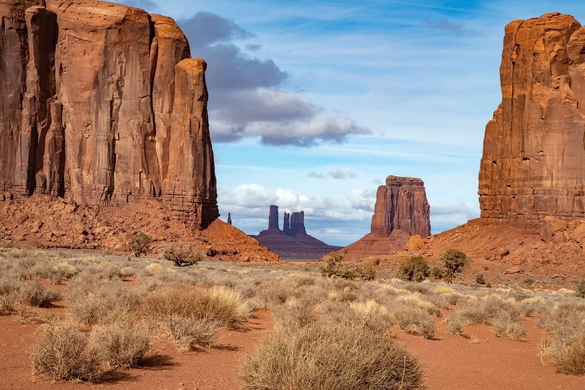 MMD_4698 · Buttes framed by red cliffs, Monument Valley, Arizona
