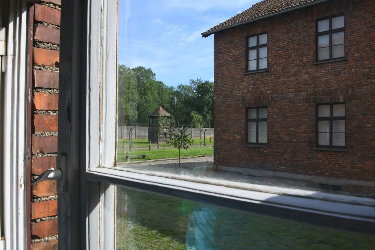 MAC_5482 · Block and watchtower seen through a window, Auschwitz I, Poland