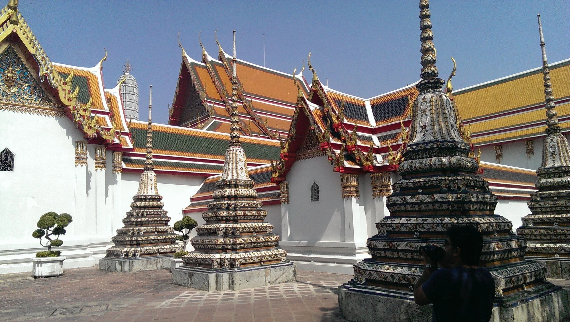 387 · Chedis and temple roofs, Thailand
