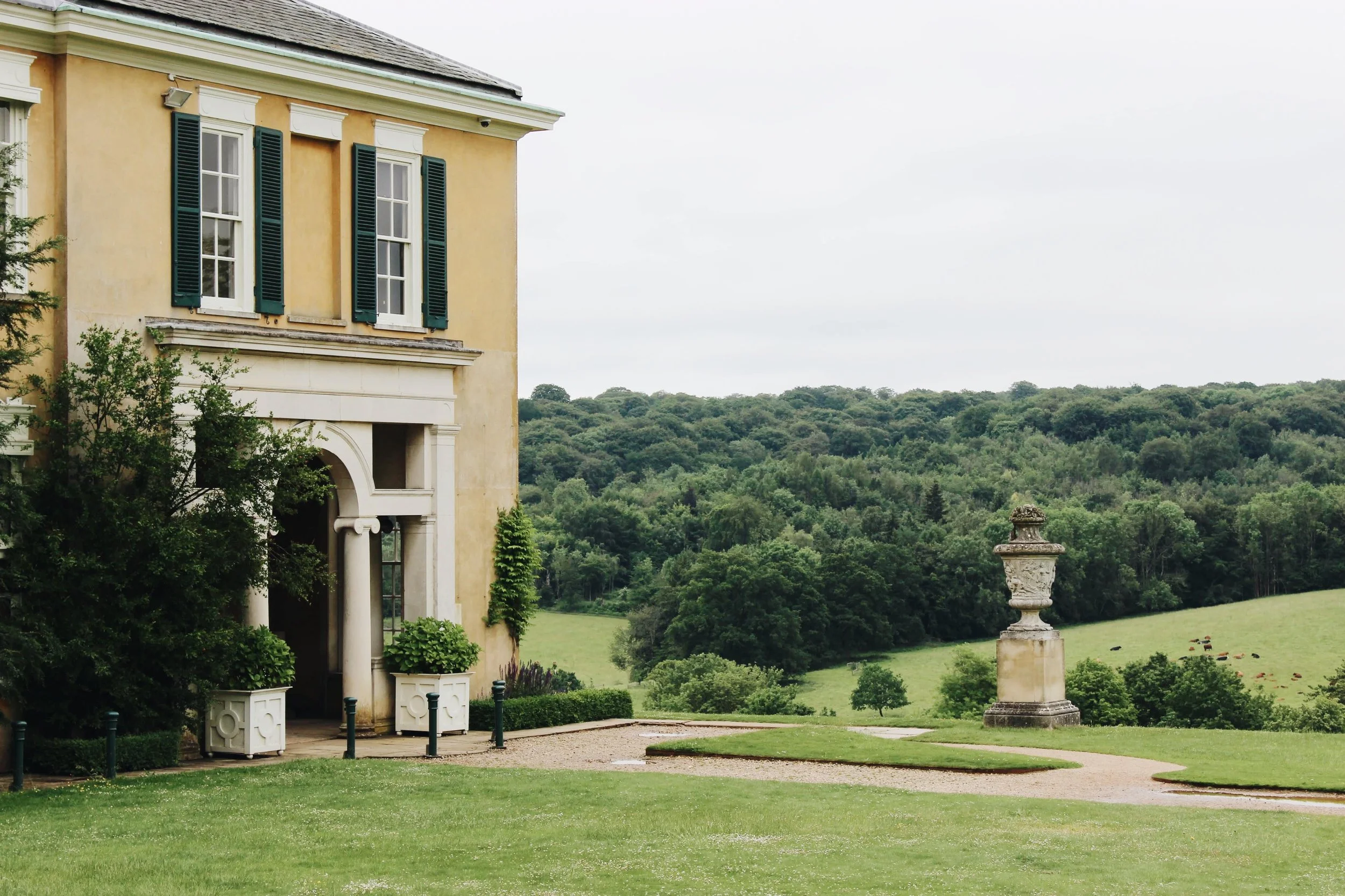 view of green parkland beyond polesden lacey house