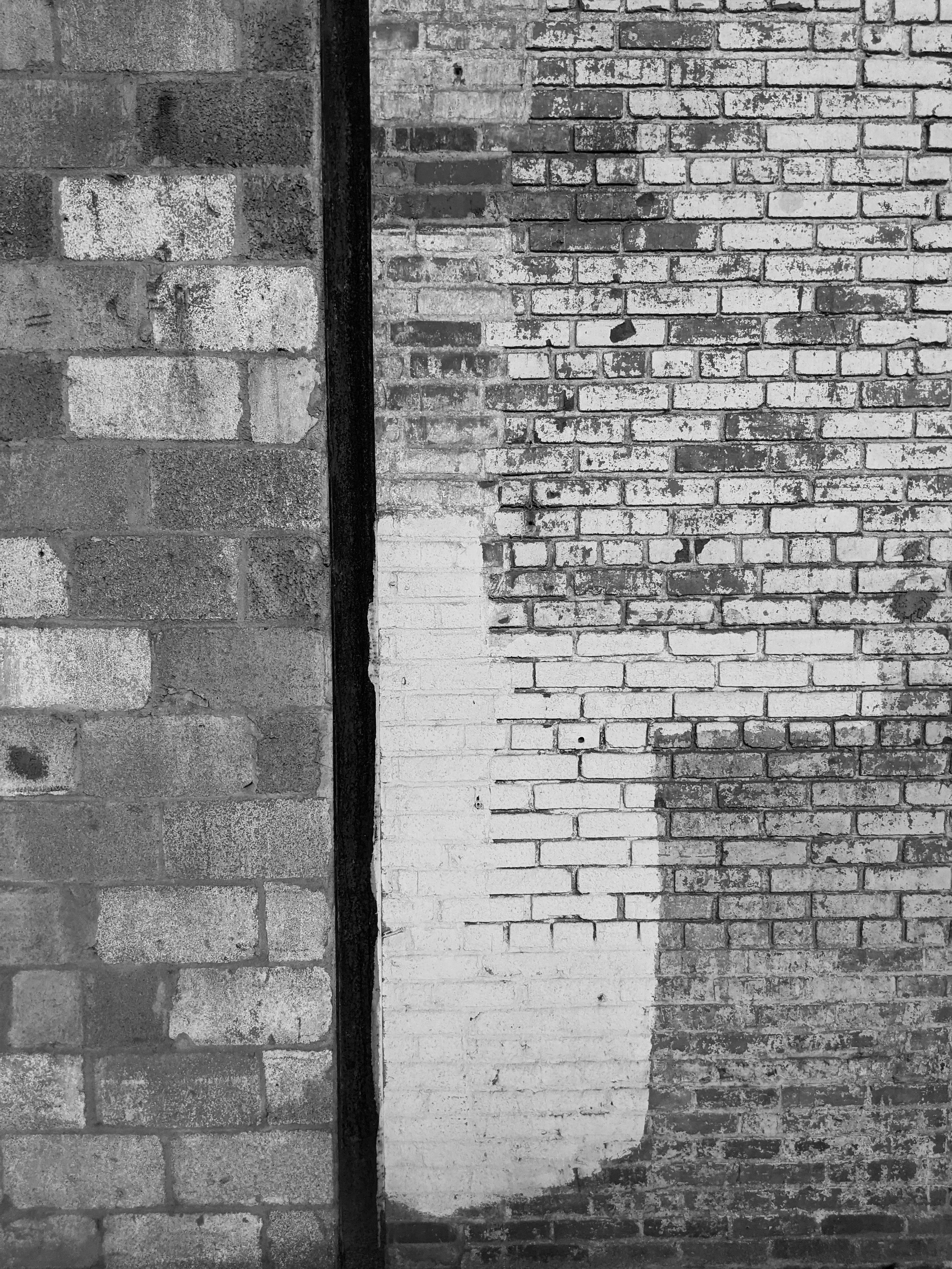 Silhouettes of two people on a boat at sunset, with a dramatic orange and purple sky reflected on calm water.
