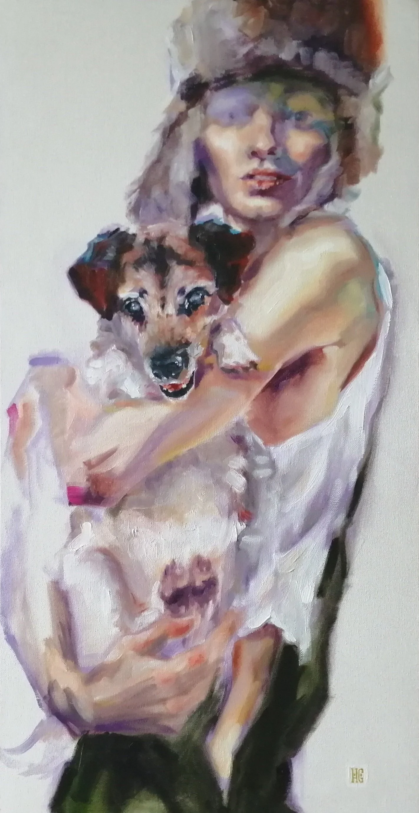 Portrait of young woman with small handsome dog