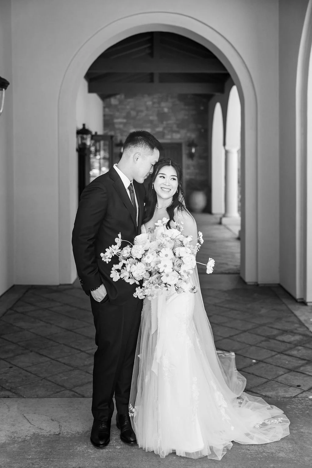 bride and groom arch