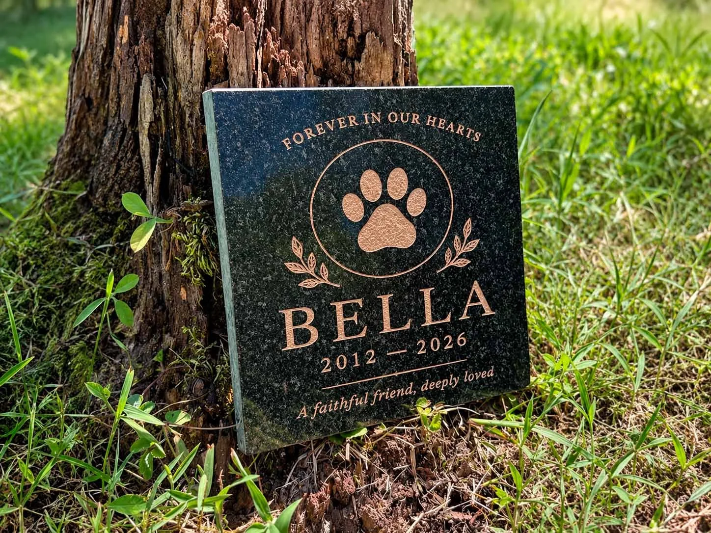 Bela with paw print, black granite memorial stone for a dog or cat, personalized with names and dates.
