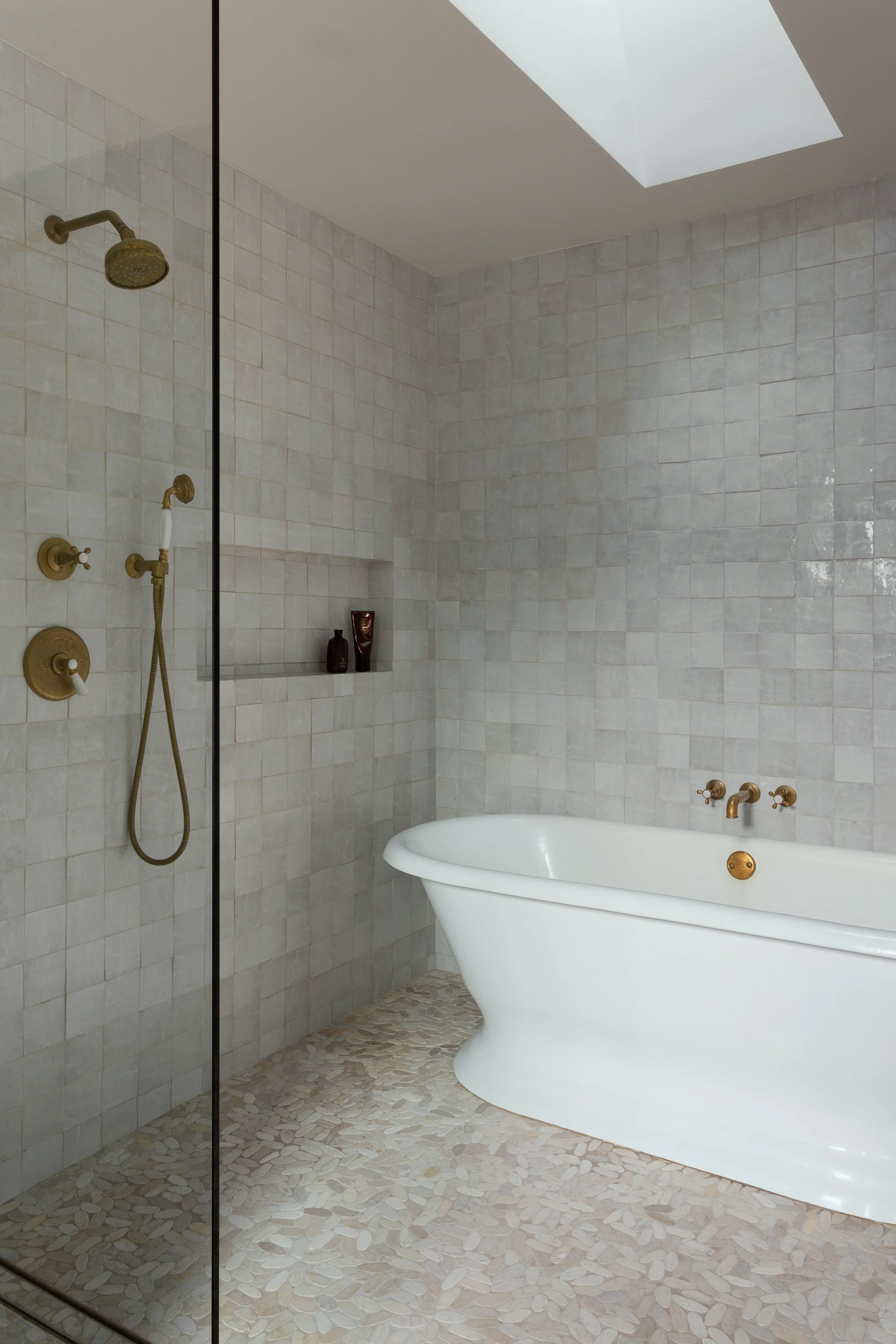 Avenida Pacific Palisades Earthy Modern Transitional Shower with freestanding Waterworks tub and zellige tile with brass fixtures designed by Hive Home