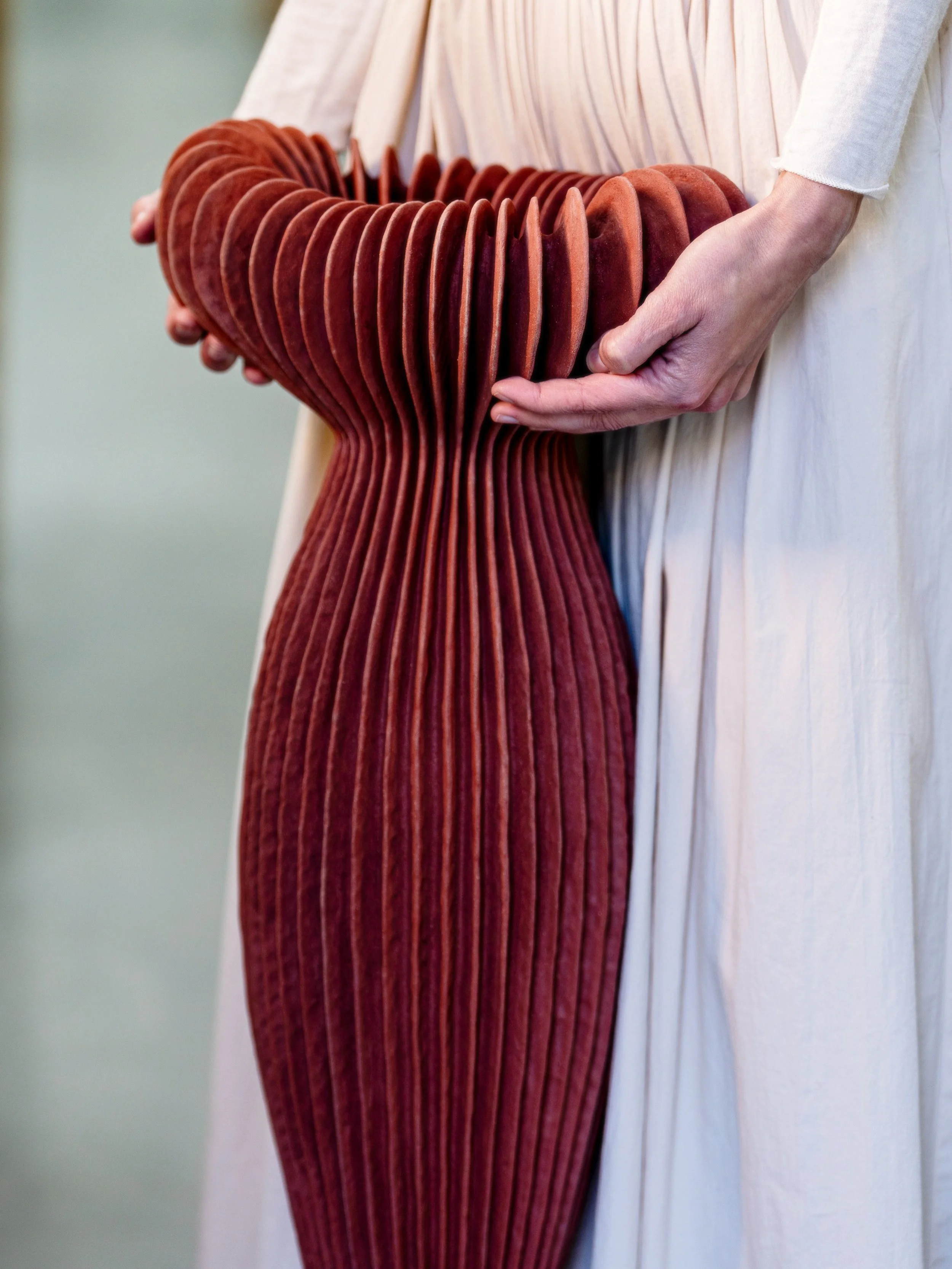 Laura Ramirez holding sculpture.JPG