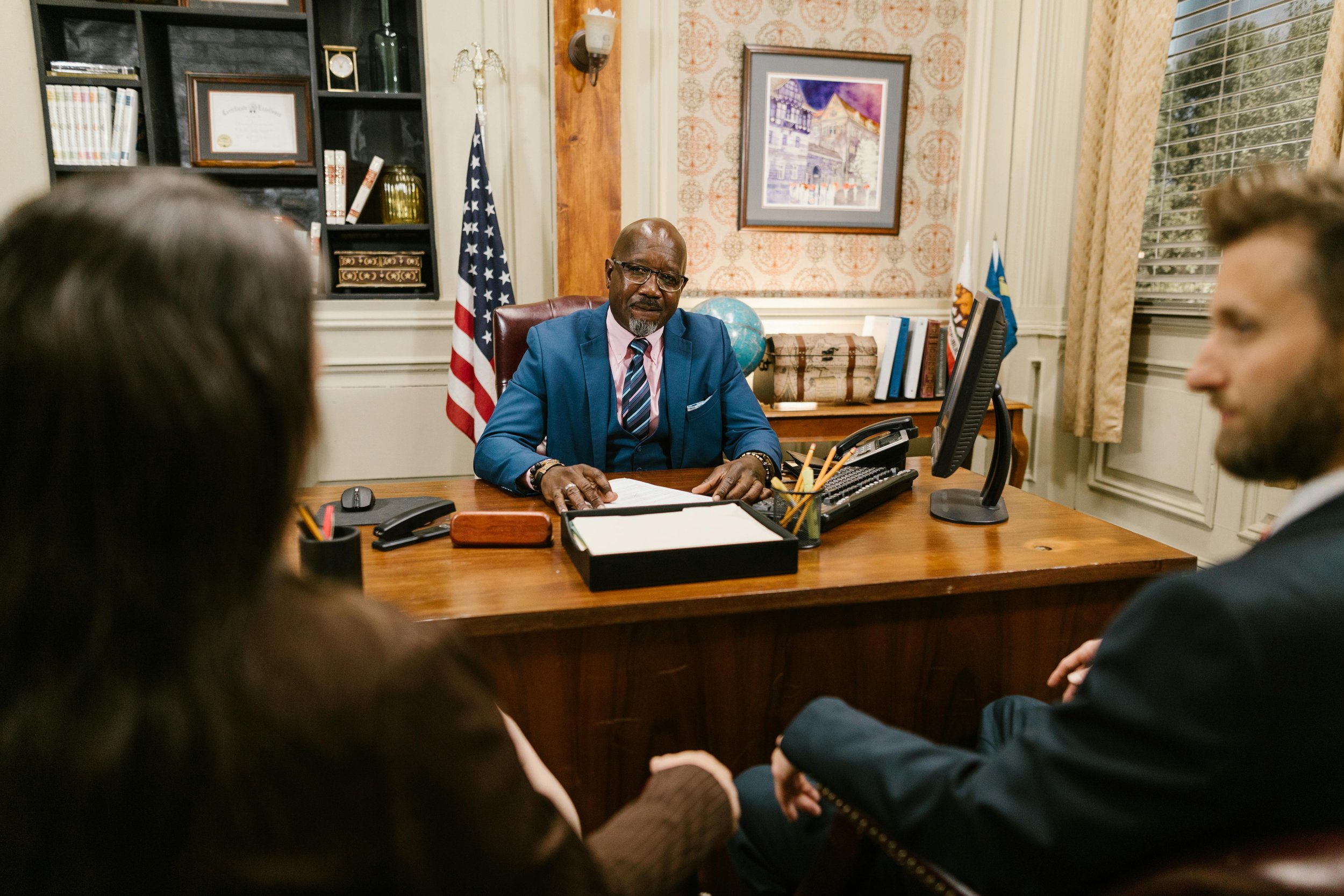 A father consulting with a criminal defense lawyer in a quiet office