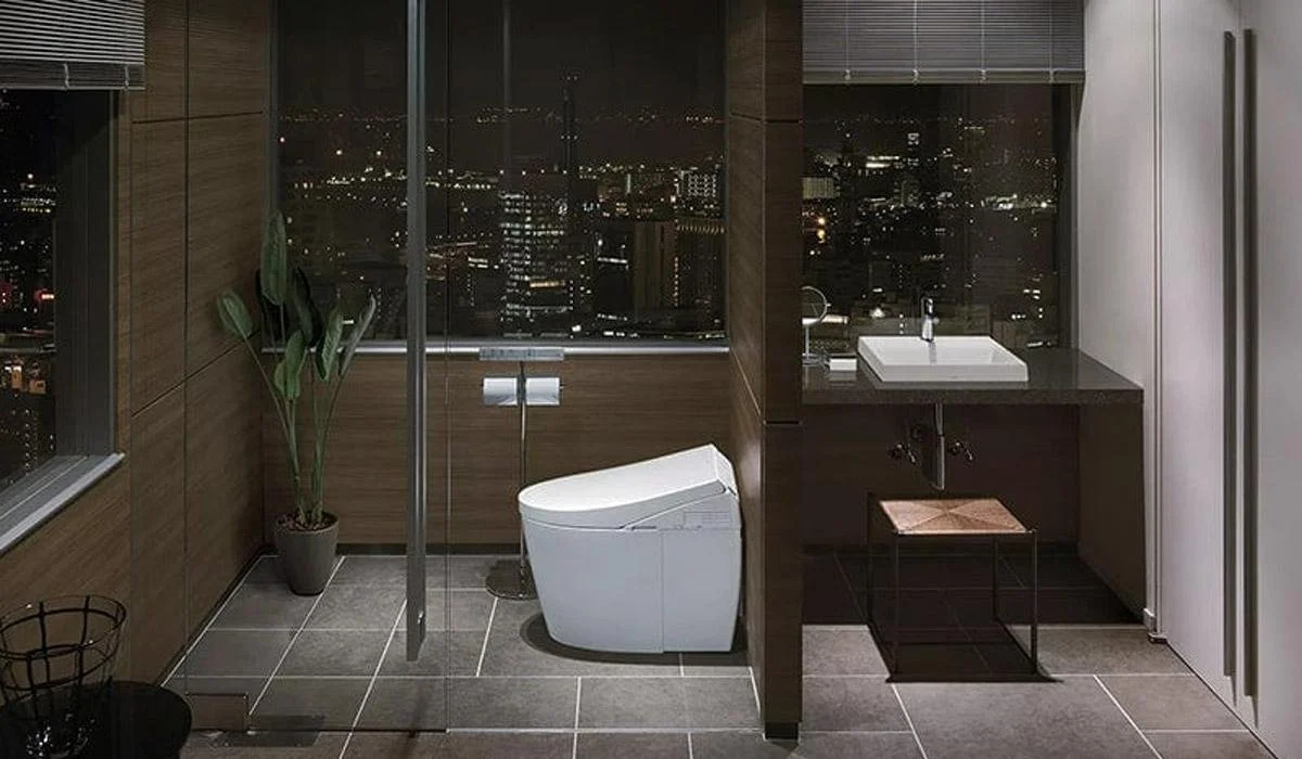 Modern white bidet toilet in luxury bathroom with city view