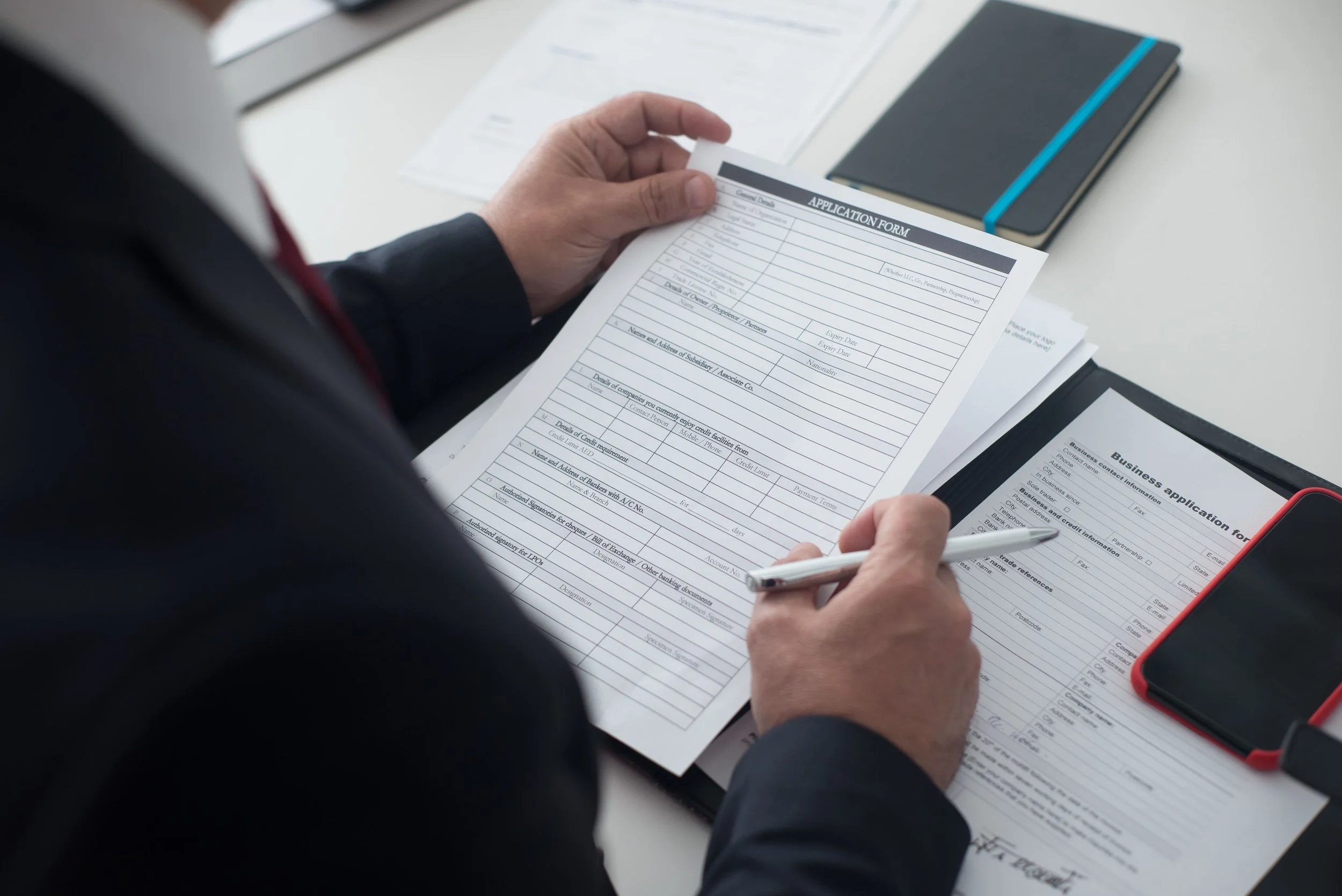 Social security application paperwork during a retirement consultation