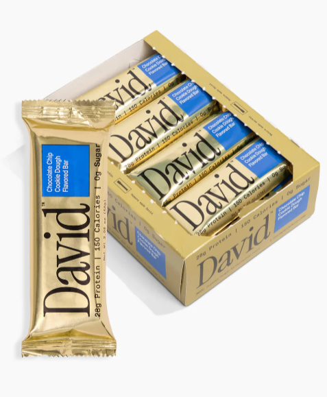 Five bars of David chocolate chip cookie dough protein bars in a yellow box, one bar outside of the box.