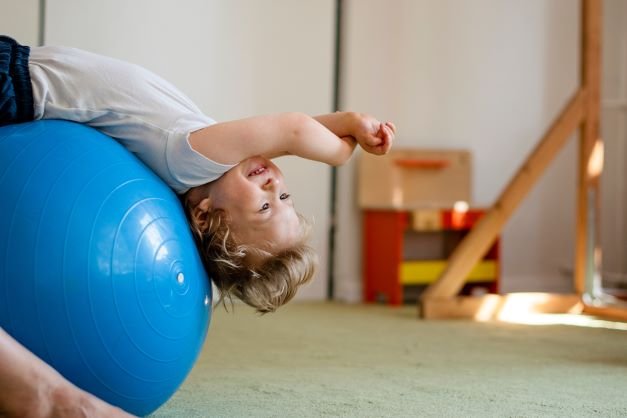 Boy practising exercises with The Spot Physio.jpeg