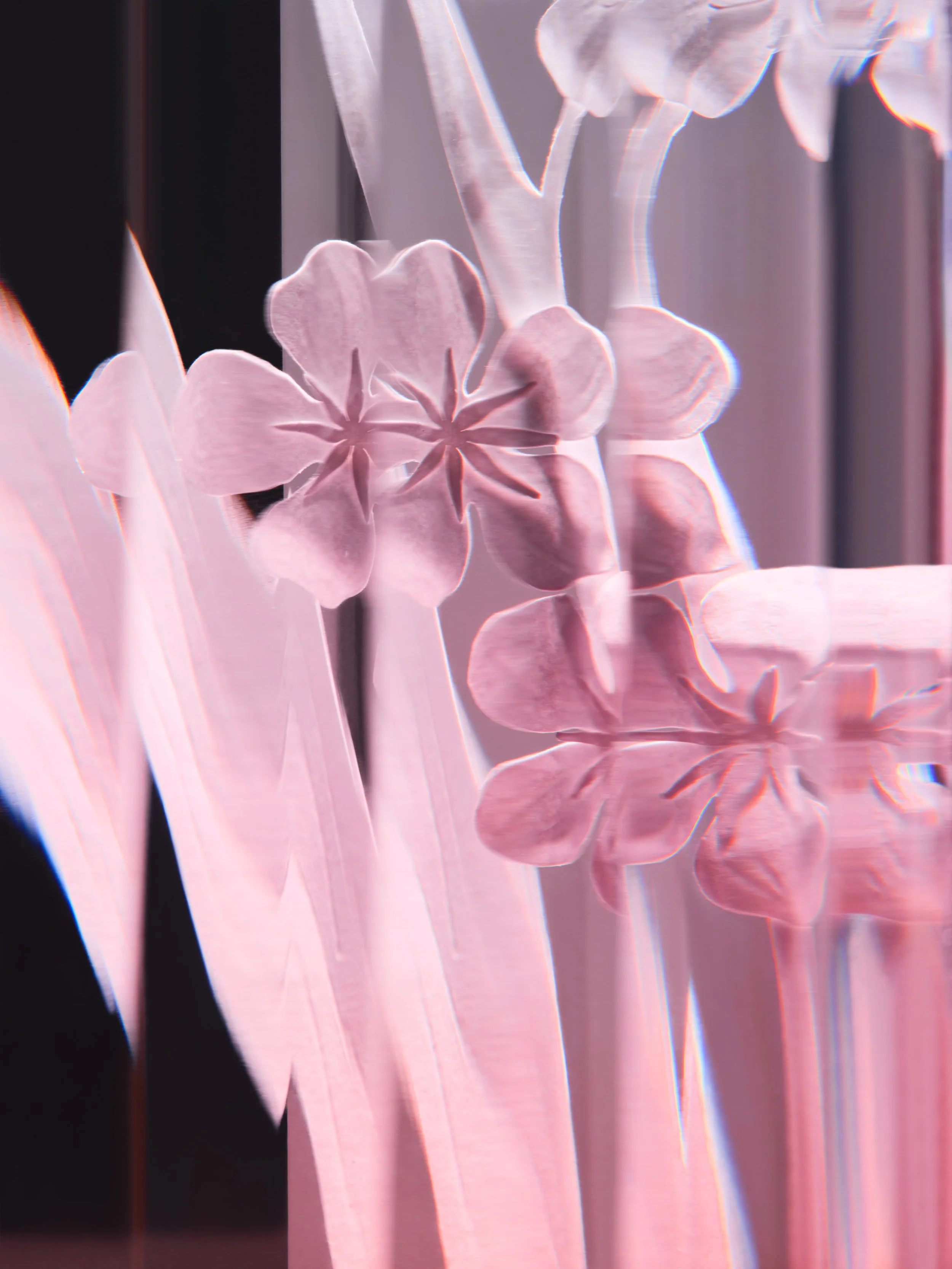 abstract photograph of intricate paperart flowers in a pink vase