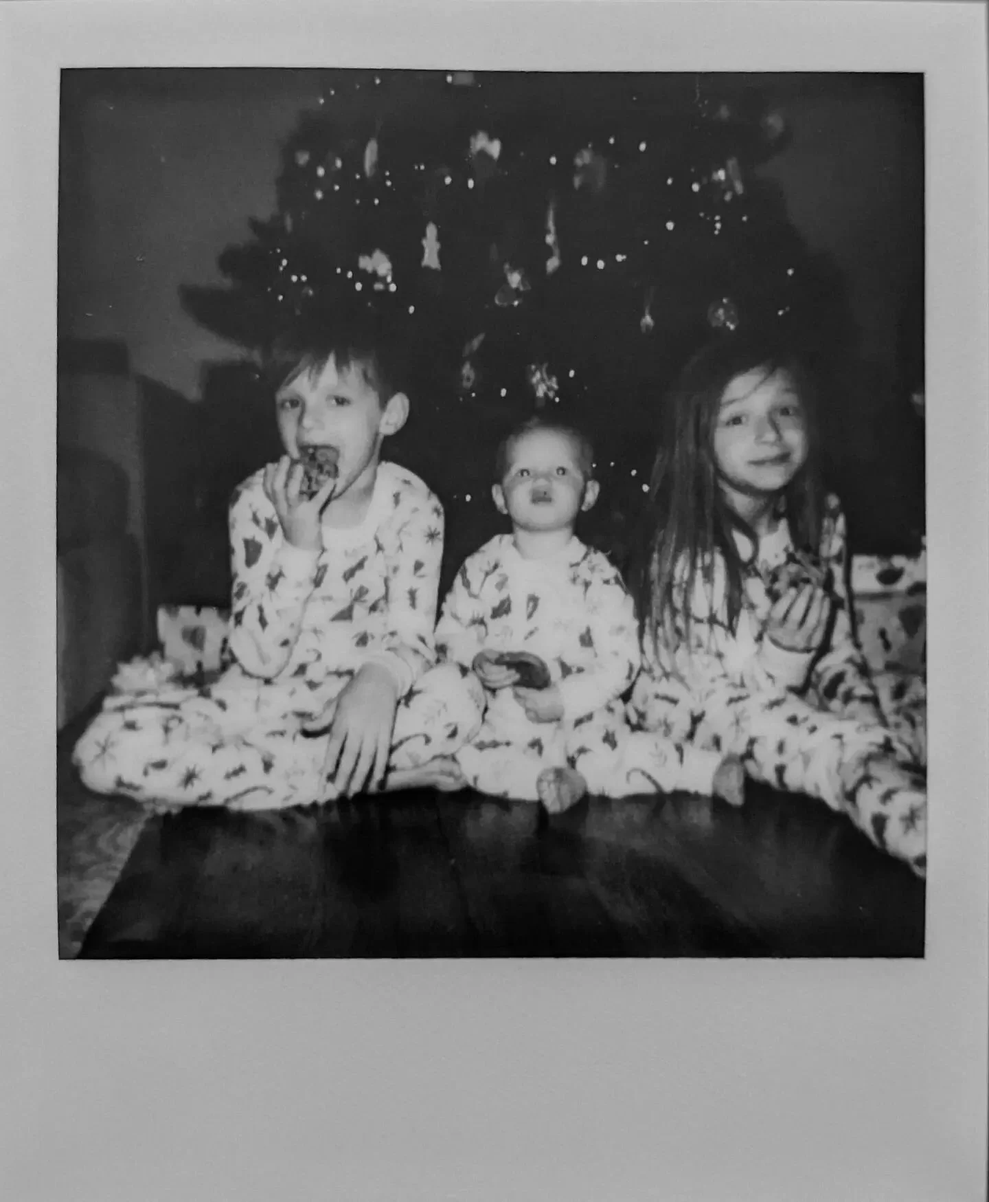 My honeys in their matching jammies snarfing down homemade cookies. 🤍🤍🤍