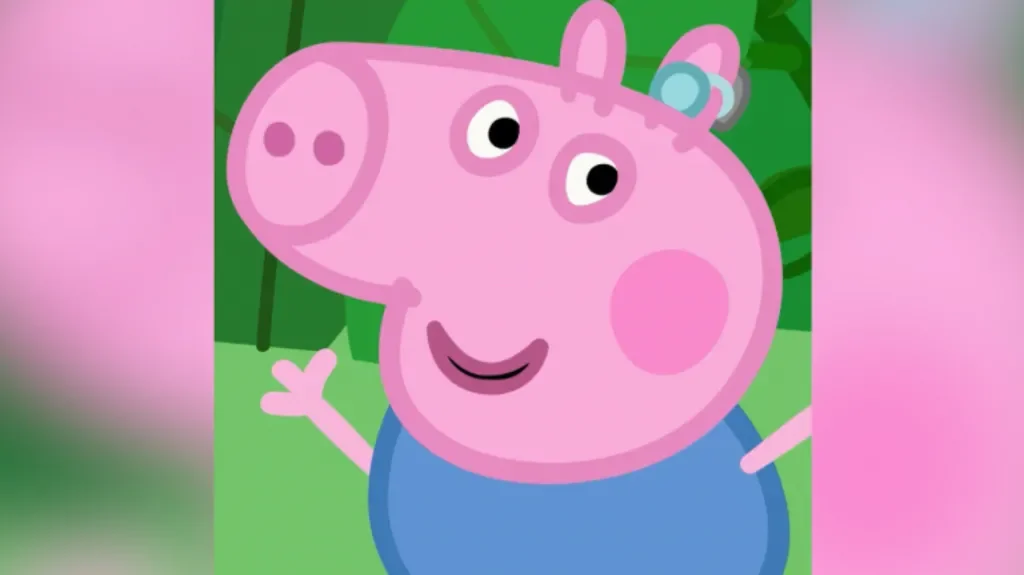 George Pig with his blue hearing aid in his left ear