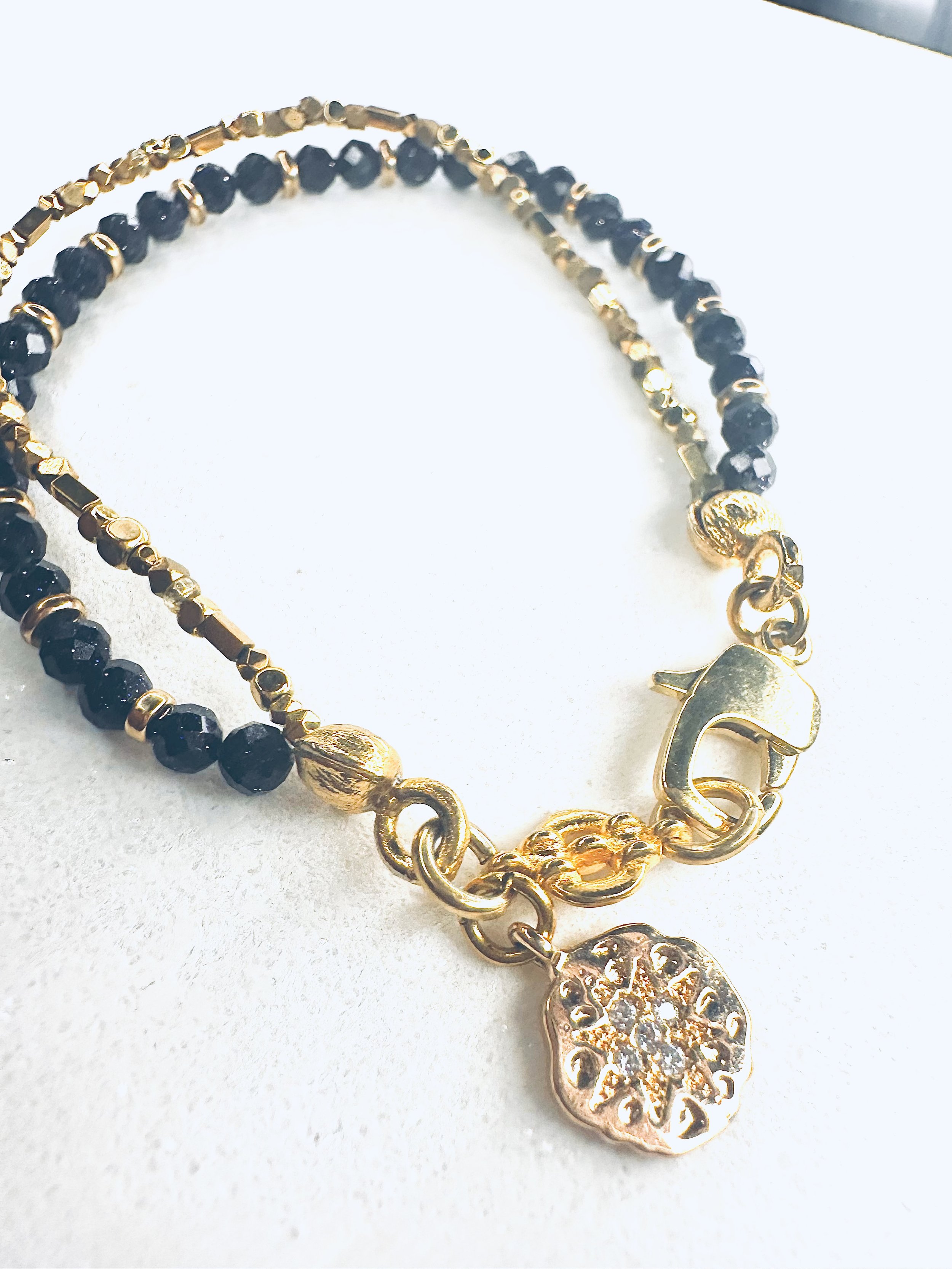 Blue sandstone beads shining bright, representing Asteria's celestial energy