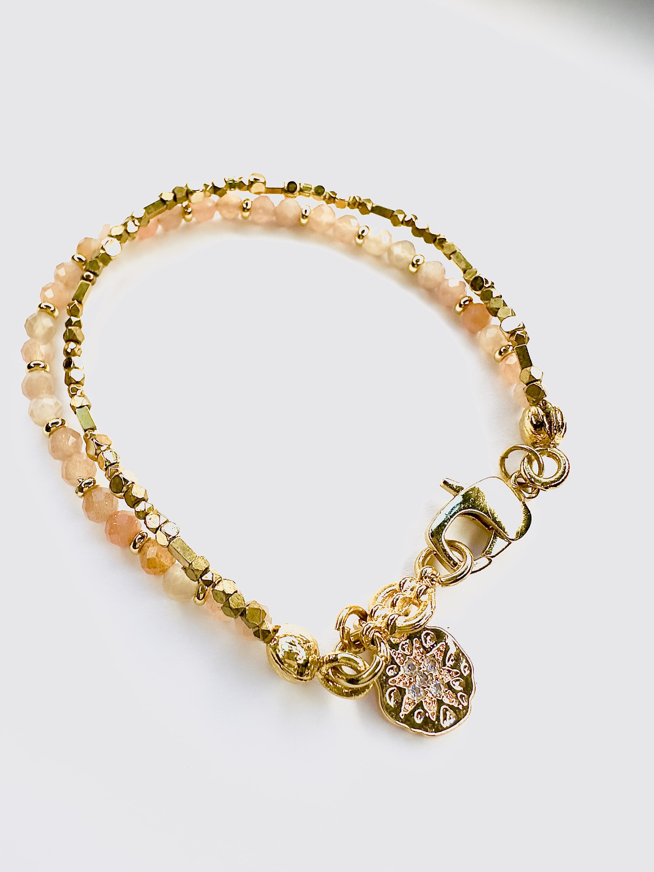 Handcrafted Ariadne Sunstone Bracelet featuring radiant sunstone beads, symbolising confidence, positivity, and new beginnings, inspired by Aurora, the goddess of dawn.