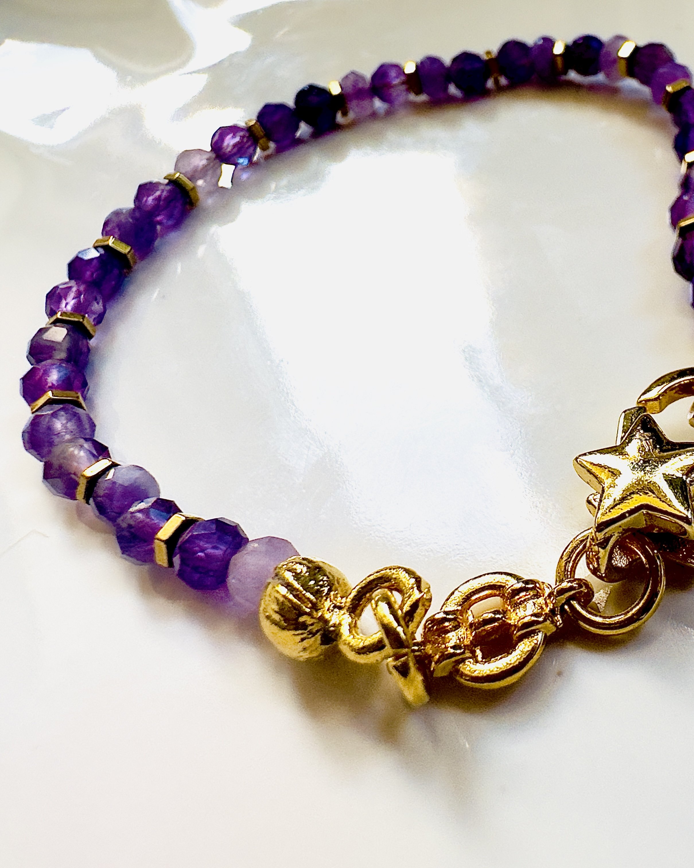 Lifestyle image of the Amethyst Celeste Bracelet, worn in a serene setting, radiating calm, clarity, and spiritual alignment through its elegant design.