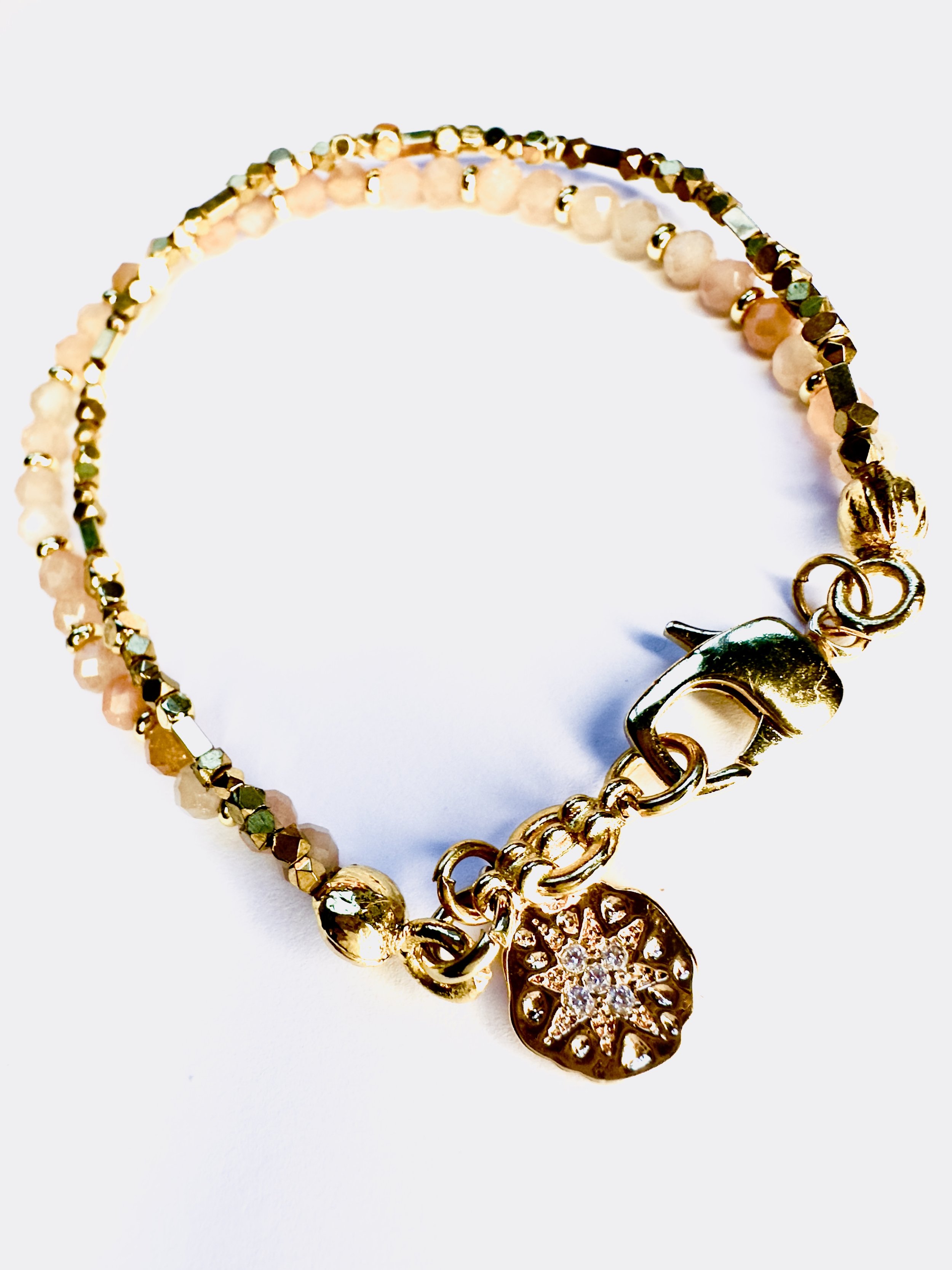 Lifestyle image of the Ariadne Sunstone Bracelet, worn in an uplifting and joyful setting, radiating warmth, confidence, and positivity through its vibrant design