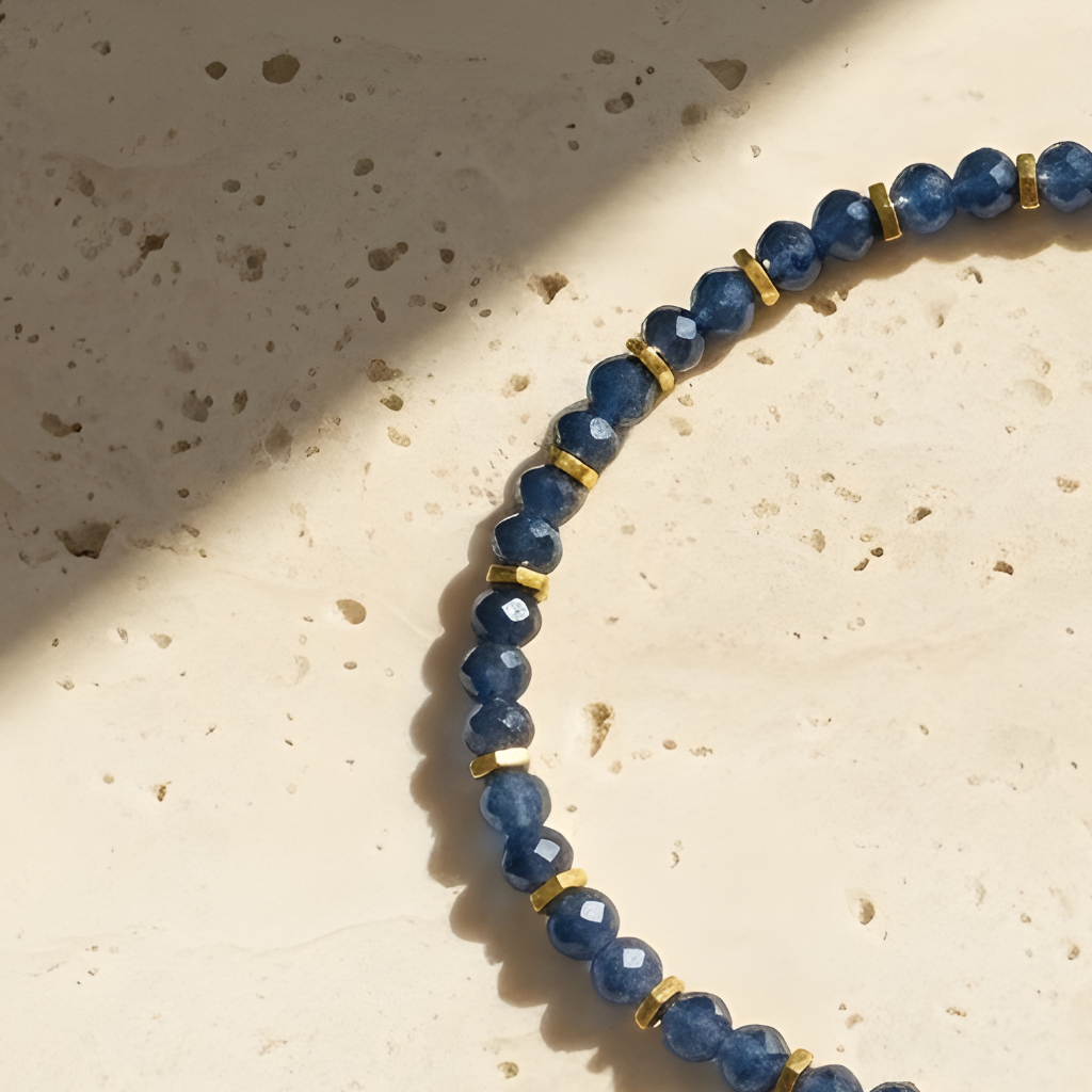 Close-up of sapphire beads showing deep blue tones with gold-toned spacers