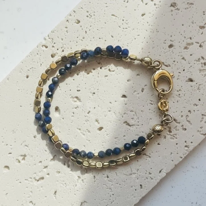 Close-up of deep blue lapis beads with natural gold flecks
