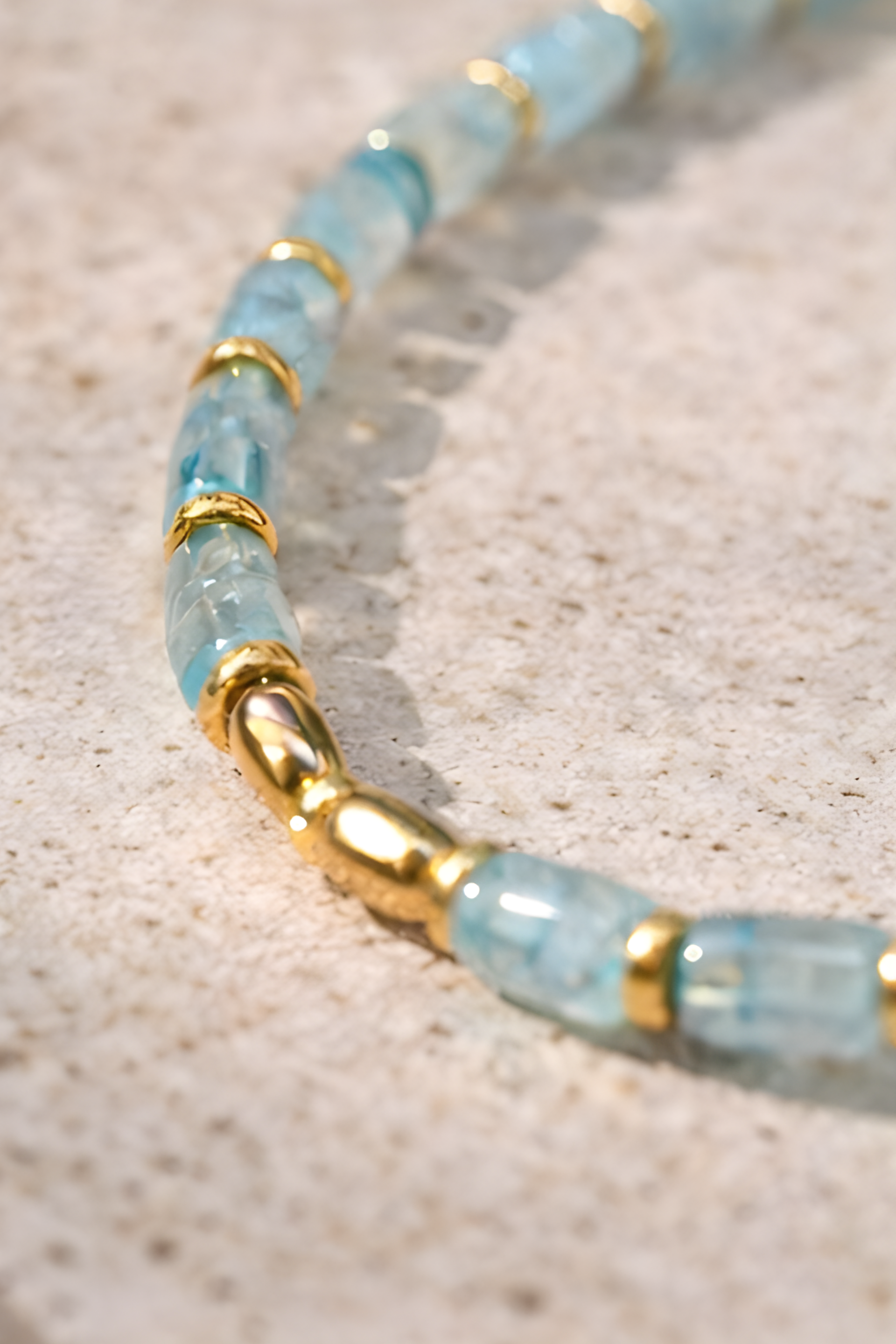 Coco Necklace with lab-made Aquamarine heishi beads and 18k gold plated haematite spacer beads, blue minimalist layering necklace by ÎLE KEKERE
