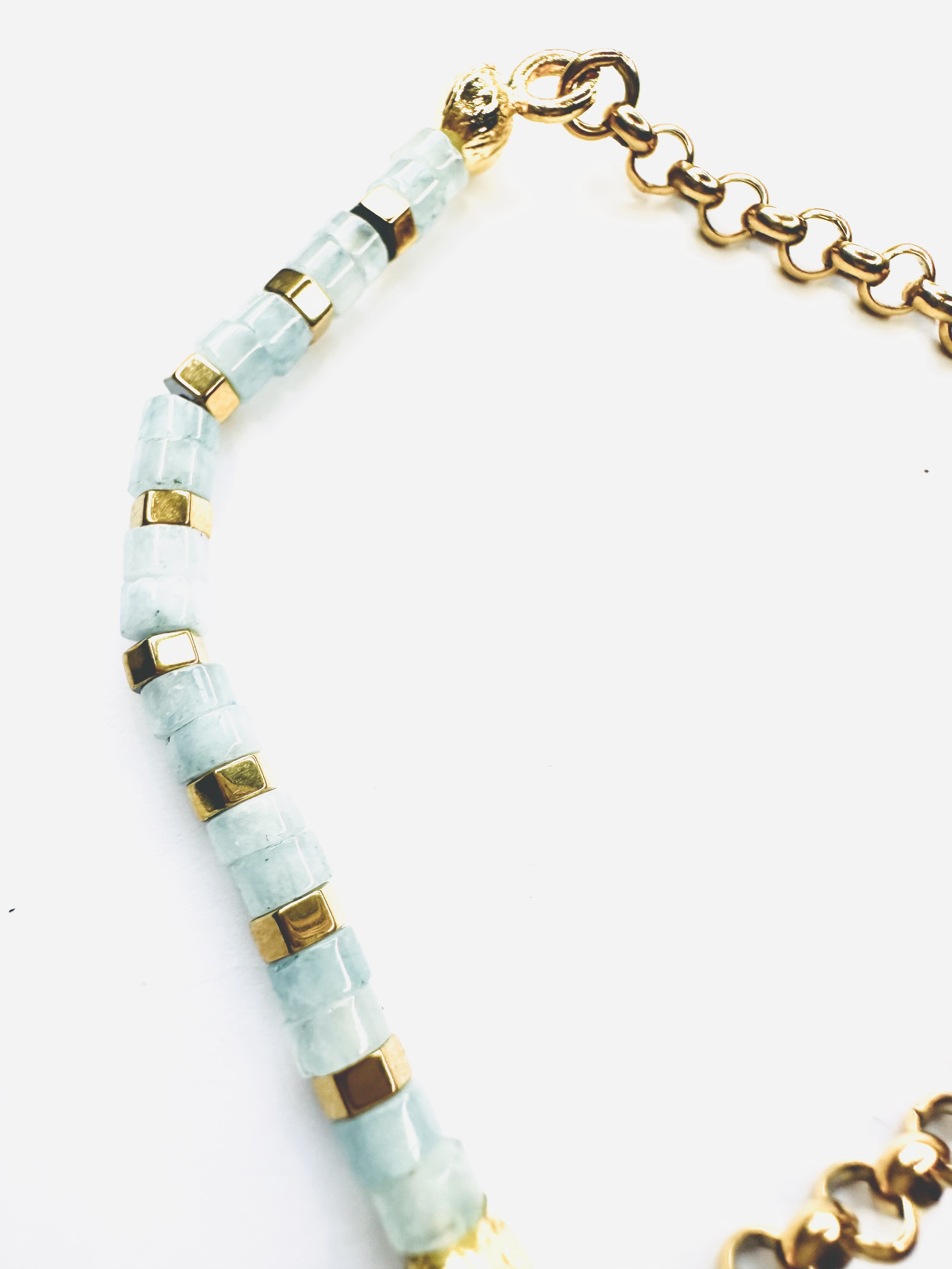 Aquamarine Ibeji Bracelet with soothing blue Heishi beads and gold-plated brass accents.