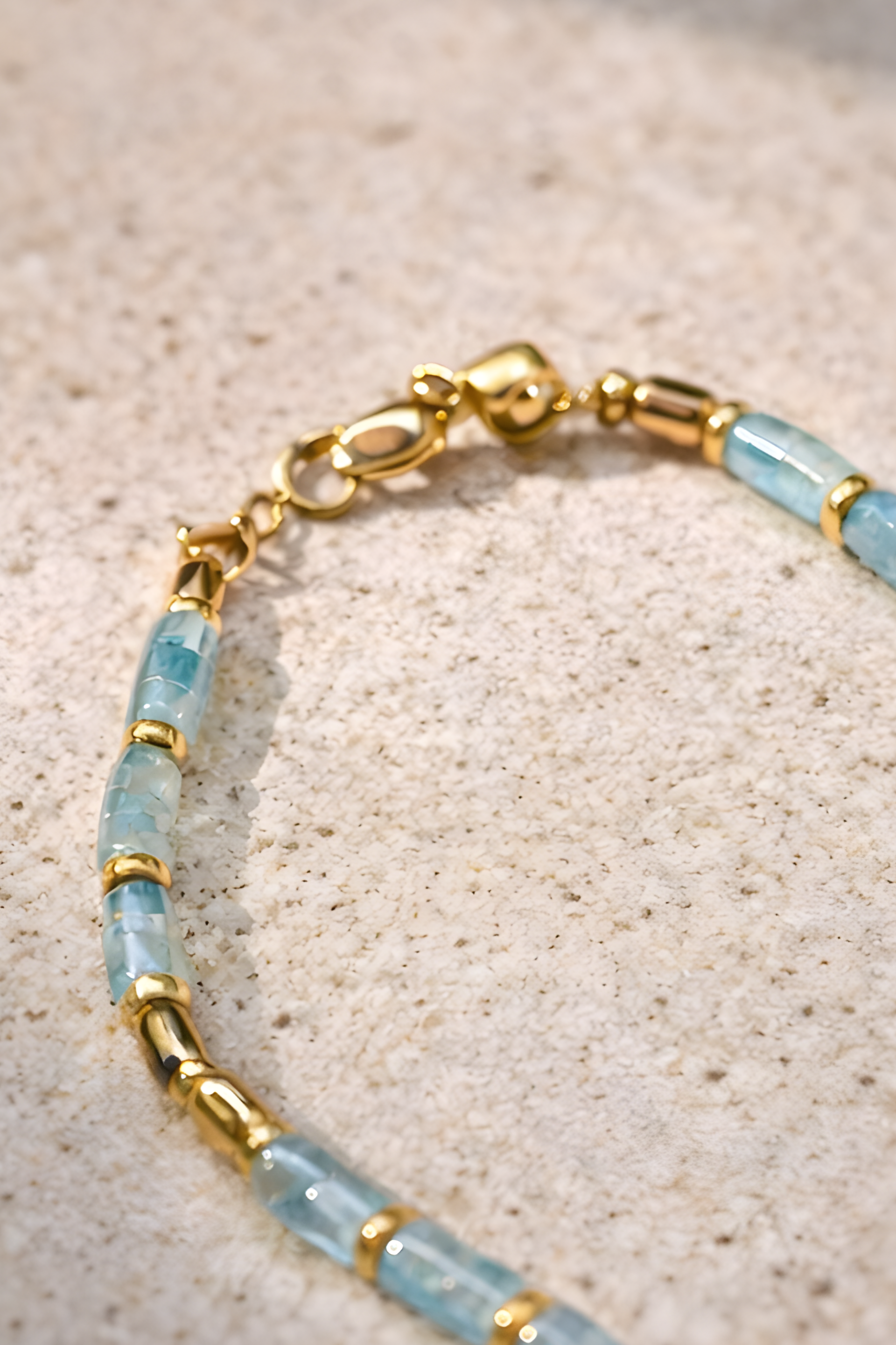 Coco Necklace with lab-made Aquamarine heishi beads and 18k gold plated haematite spacer beads, blue minimalist layering necklace by ÎLE KEKERE