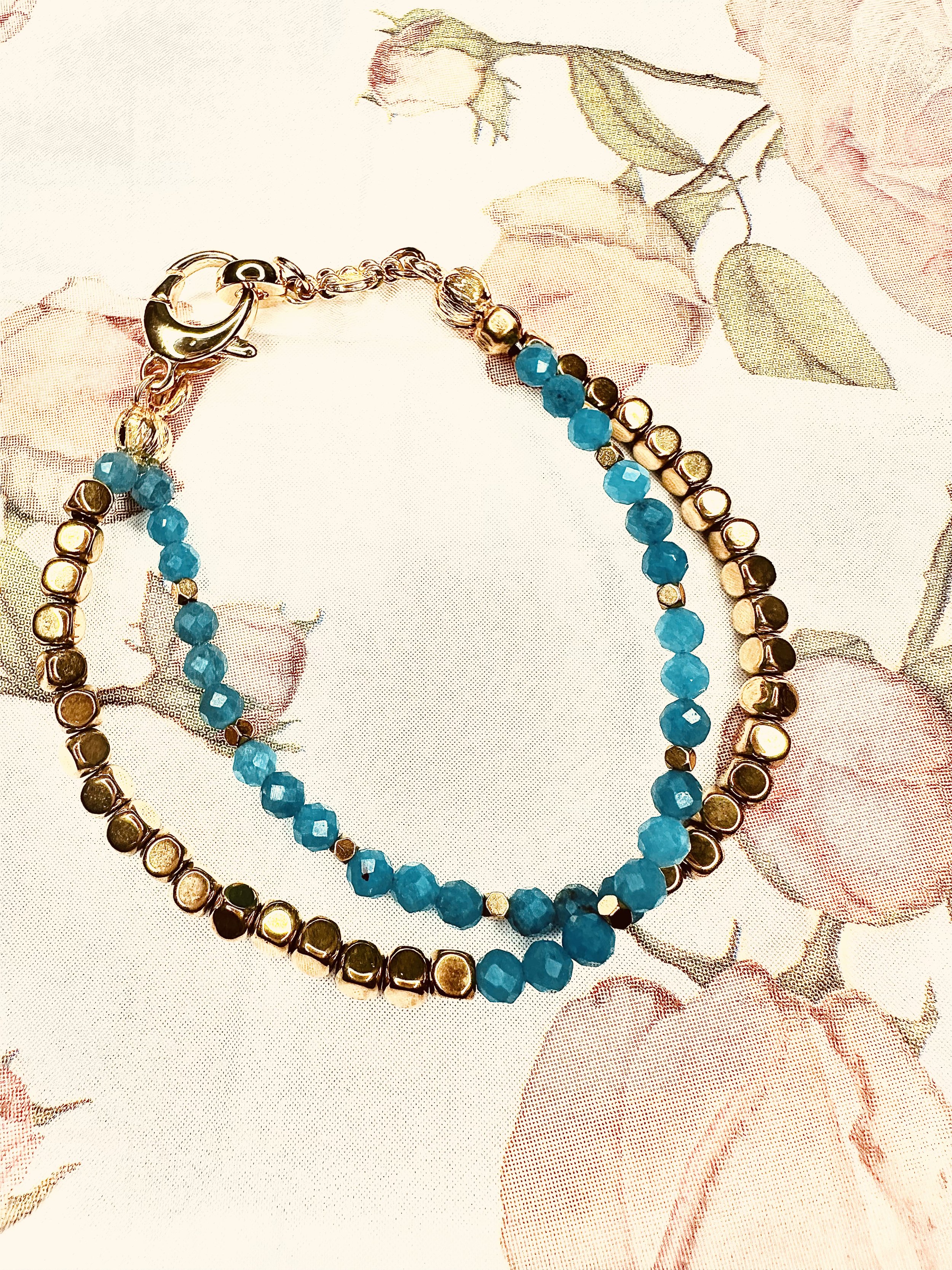 Petra Bracelet with Blue Chalcedony, featuring soft blue gemstone beads and gold-plated haematite accents.