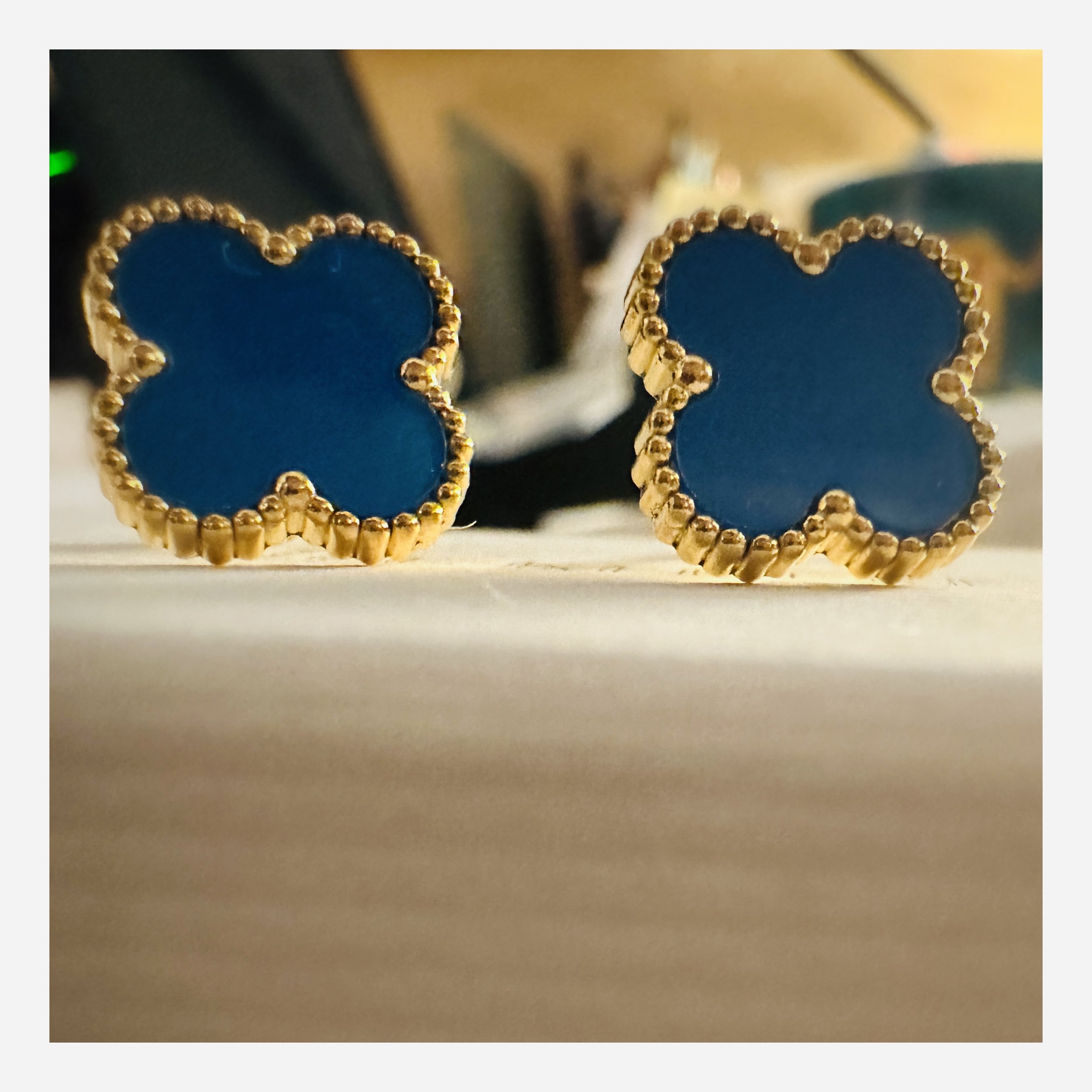 The hypnotic blue Flora Studs evoke memories of calm seas, whispering a tale of chic sustainability from your lobes.