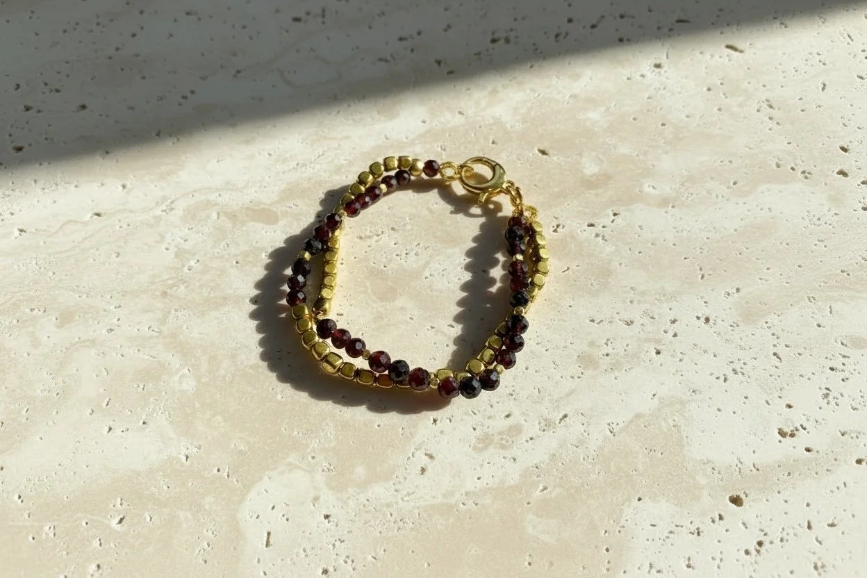 Petra Garnet bracelet worn with warm-toned styling