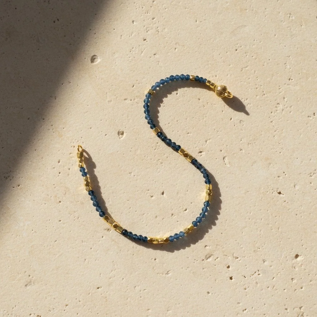 Close-up of sapphire beads and gold tone accents on Ibiza bracelet