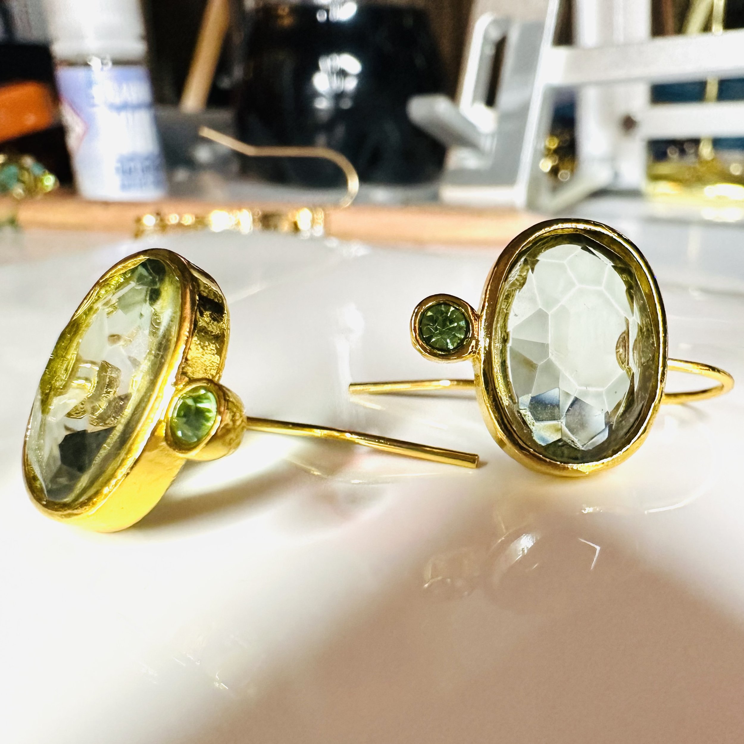 Arielle Earrings by ÎLE KEKERE featuring fresh green tones in peridot-coloured glass and cubic zirconia