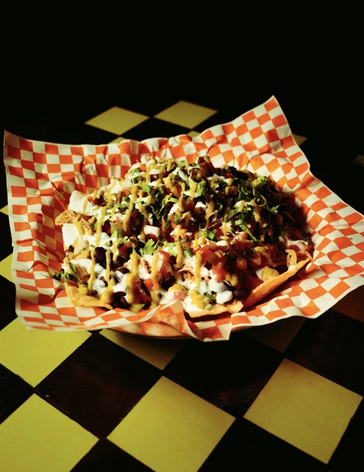 Build-your-own nachos at Chartreuse Saloon, a fun, popular games/pool bar in the Crossroads of Kansas City