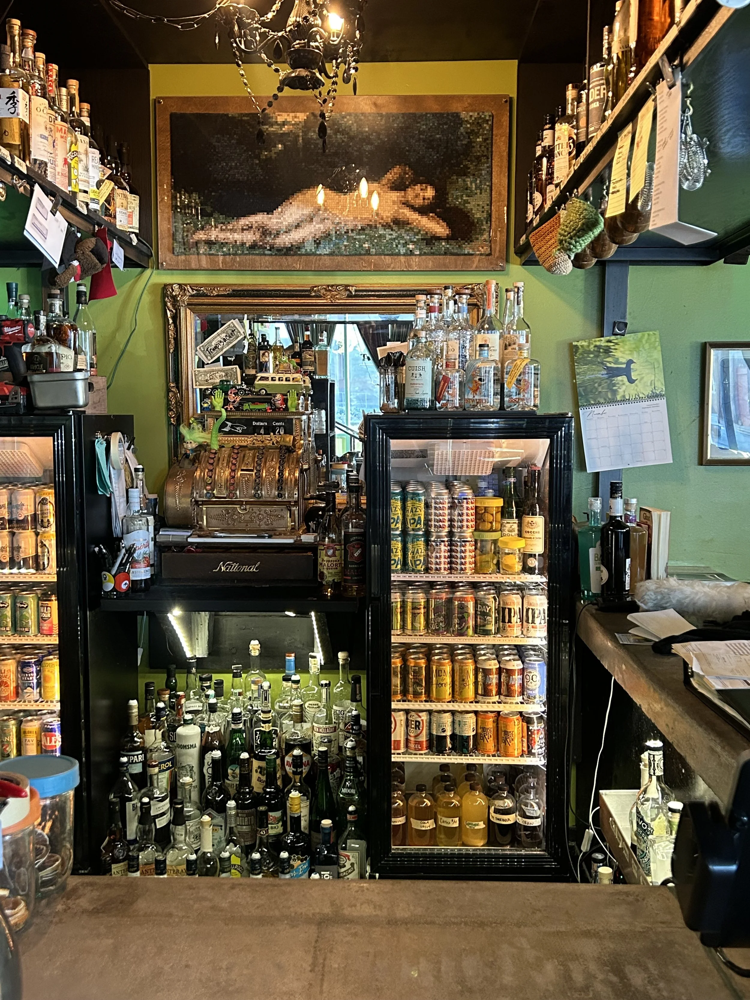 Back bar of Chartreuse Saloon in Kansas City featuring craft beer, cocktails with homemade mixers, wine, seltzers and NA options!