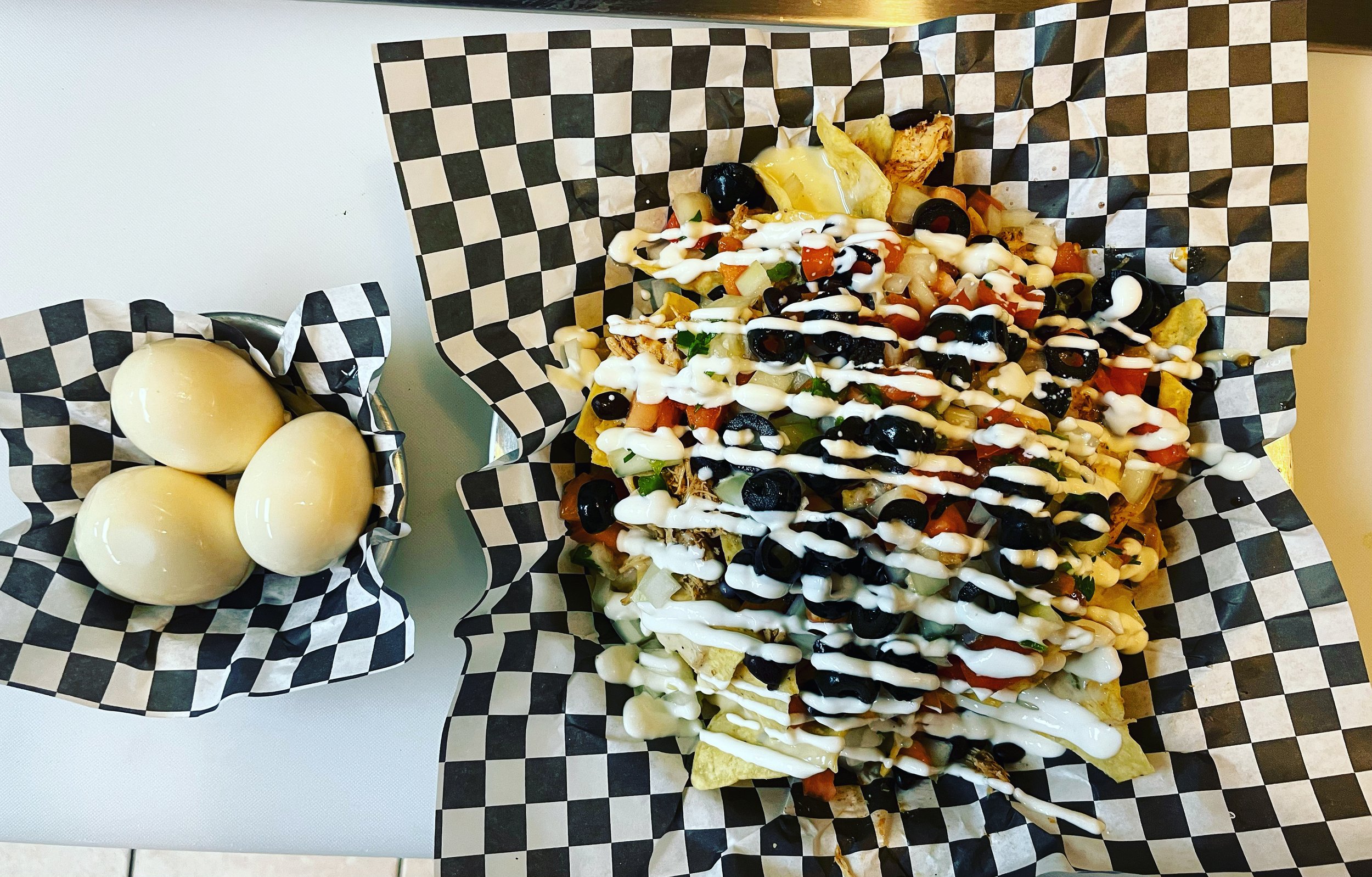 Chartreuse Saloon custom nachos and house-pickled eggs!